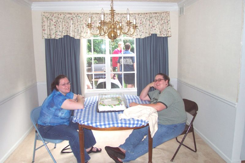 Callie and Rachel guarding the cake